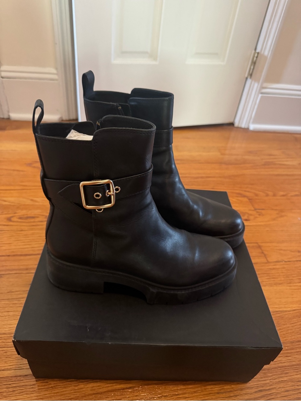 Coach Black Leather Ankle Boots with Gold Buckle Accent